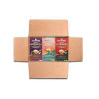 Unbox Miracle Trees Verve Bundle containing three flavors of Energy Moringa Tea: Vanilla Oolong, Peach Apricot, and Cherry Chamomile. Enjoy this vibrant coffee alternative with an organic energy boost from moringa superfood in each colorful package.